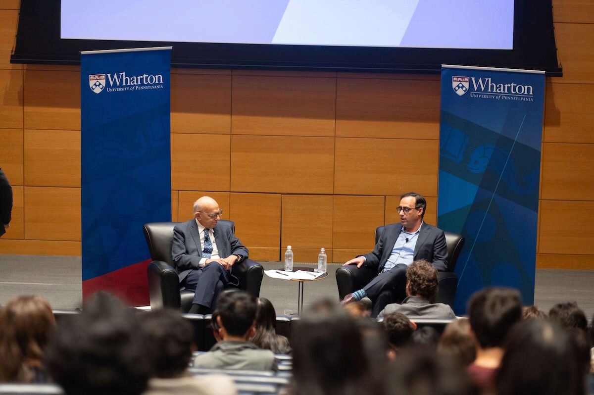 Professor Jeremy Siegel and Matt Levine sit in discussion before an audience