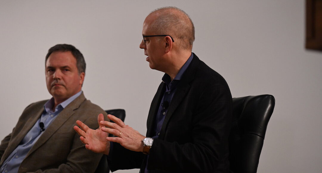 David Musto moderates a panel with Eduardo Moore sitting to his left
