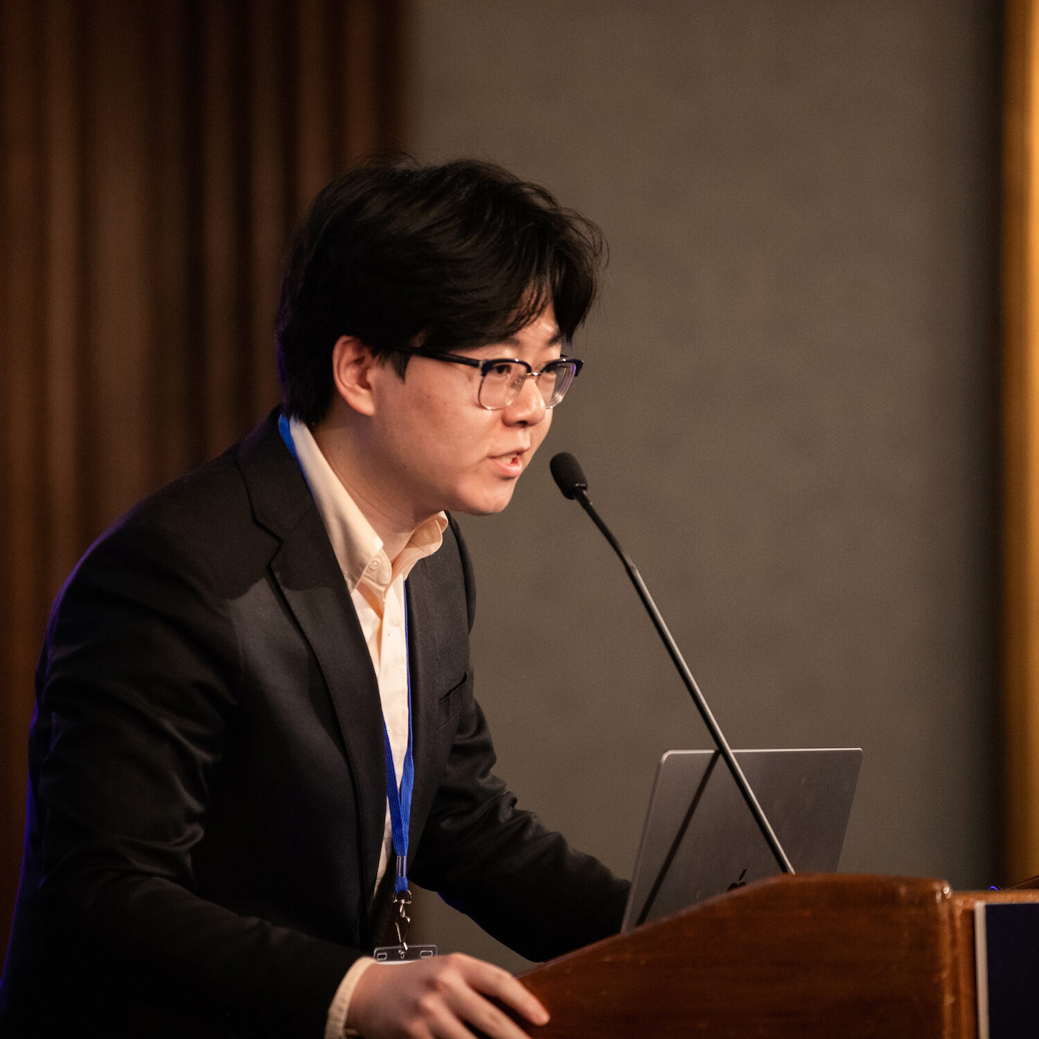 A presenter speaks at Demo Day