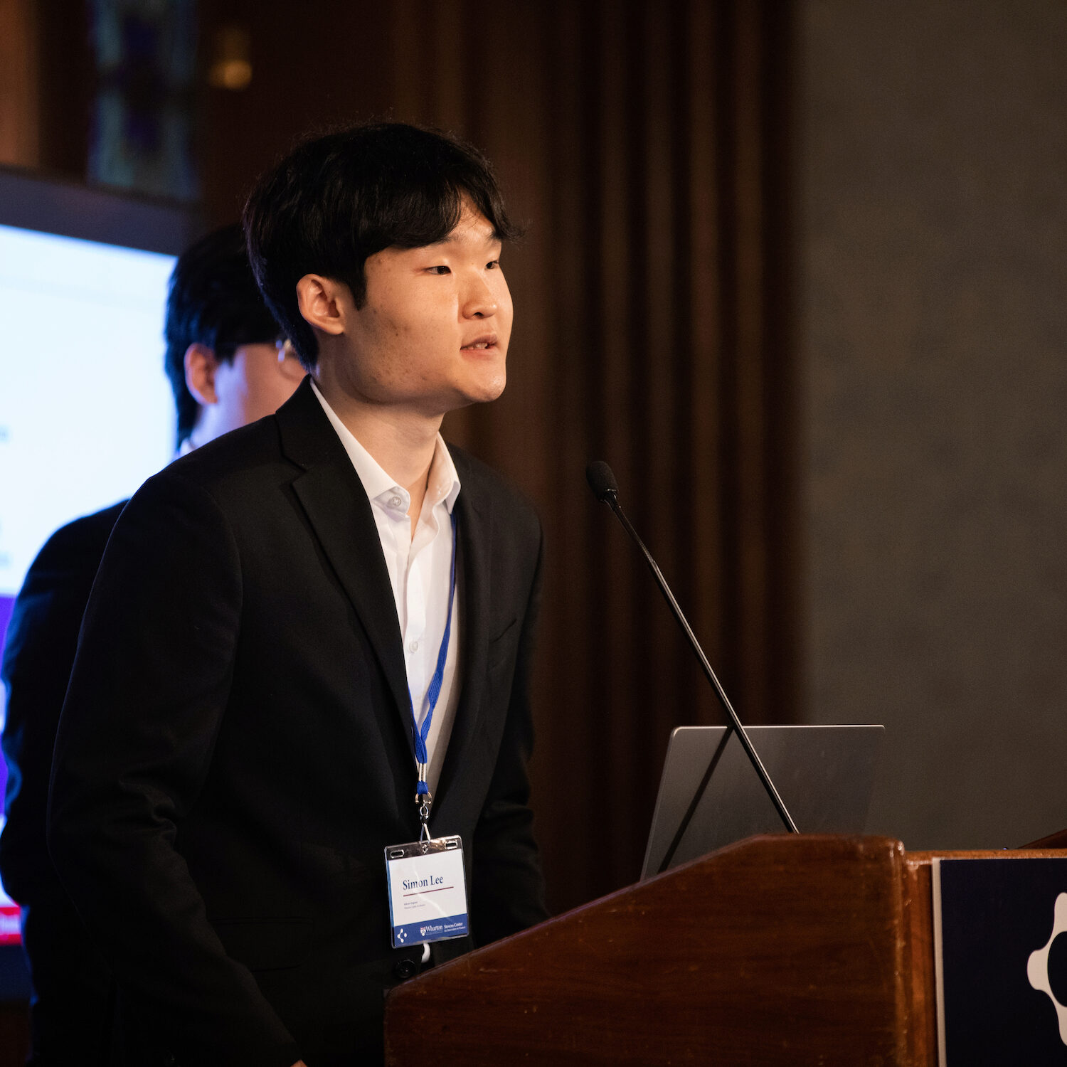 A presenter speaks at Demo Day